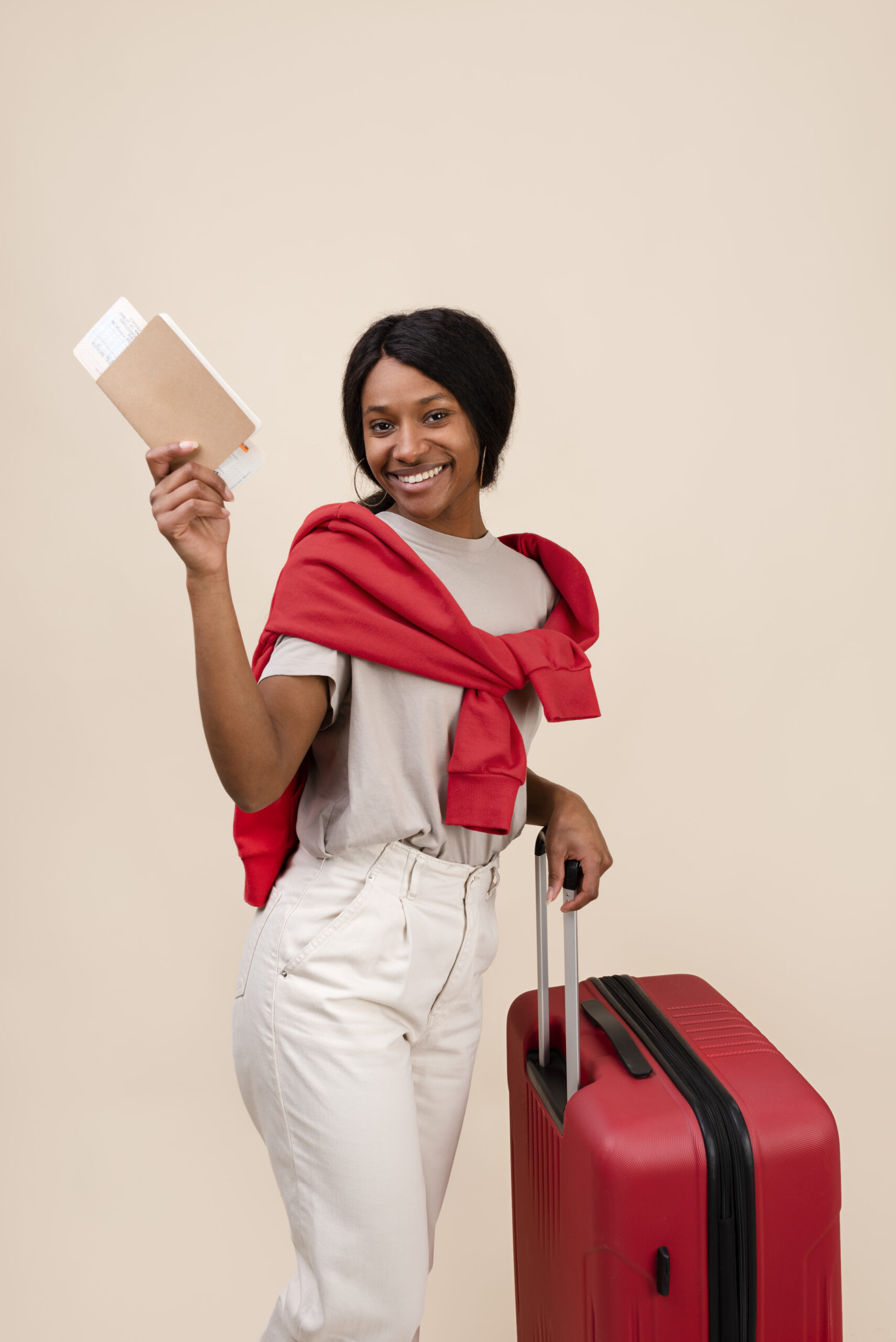 smiley woman with red baggage medium shot